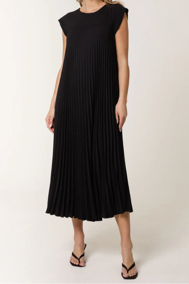 Woman wearing a black dress against a white background