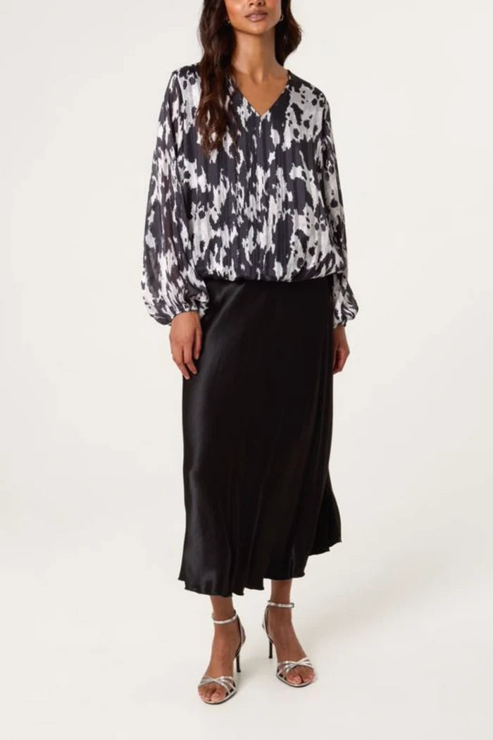 Cow Print Bubble Hem Top